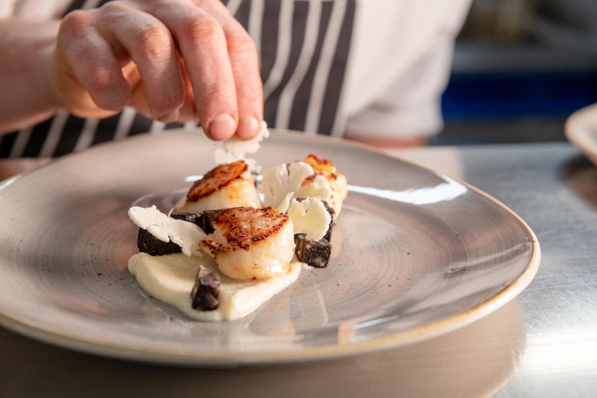 Hotel The Millstone, Mellor Blackburn  Exterior foto A chef finishing a plate of scallops